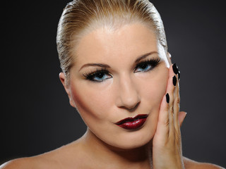 Fall fashion makeup and manicure trend. pretty woman face with p