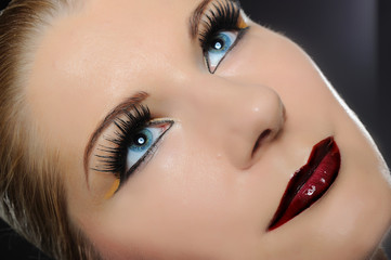 Fototapeta premium Fall fashion makeup trend. pretty woman face with bright make-up