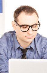 businessman with laptop computer in office