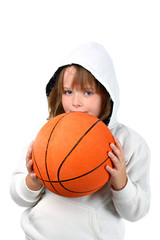 Small girl in hood sweatshirt plays basketball isolated on white