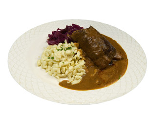 freshly cooked stuffed rouladen with potatoes and cabbage