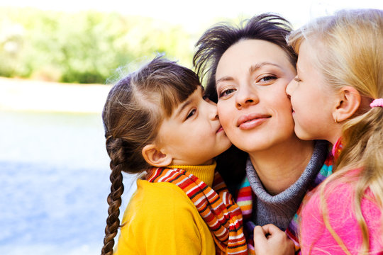 Kids Kissing Mother