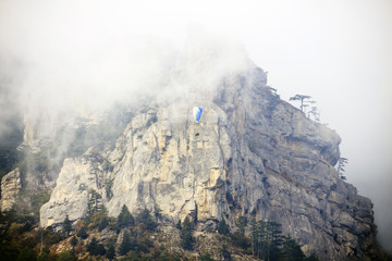 in a fog against the backdrop of the mountains