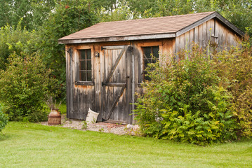 A charming, rustic garden shed made from reclaimed timber