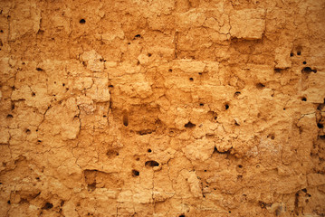 Abstract background in the form of the cracked clay wall