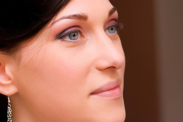 closeup of a beautiful brunette young lady with make up