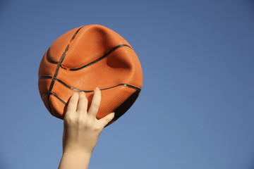 close up shot of a hand holding a flat ball