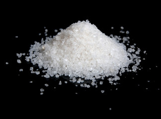 Heap of salt isolated on black