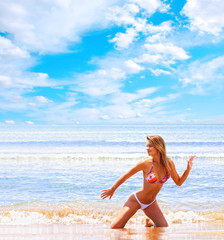 Fototapeta na wymiar beautiful model relaxing on a beach