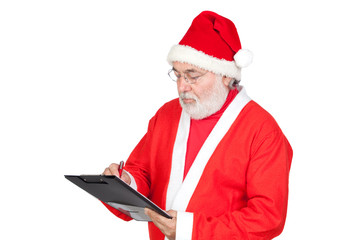 Santa Claus writing on clipboard