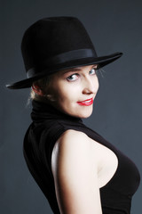 Sexy blonde woman with hat. Erotic art photo.