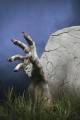 Zombie hand coming out of the ground