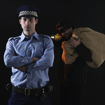 Policeman and thief. Robbery scene.