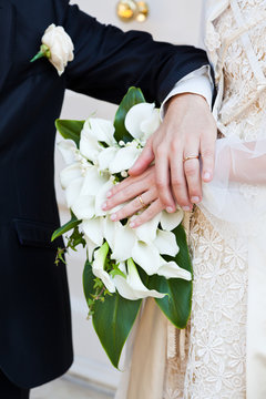 Bride and Groom Hand with Wedding Ring