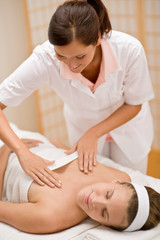 Fototapeta na wymiar Skincare - woman cleavage massage at salon