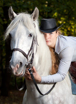 Young Lady Hugging Her Horse