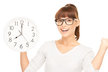woman holding big clock