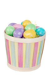 isolated easter basket with colorful eggs