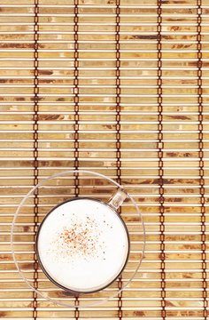cappuccino cup on bamboo mat