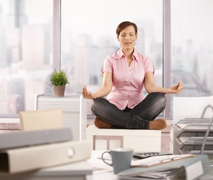 Relaxed office worker doing yoga