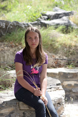 Teen poses with ears of wheat
