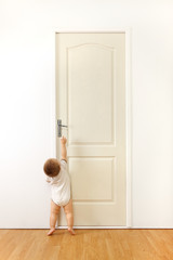 Baby in front of door