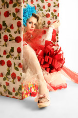 The doll in a gift box.