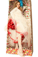 The doll in a gift box.