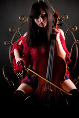 Brunette girl in red with cello © Max