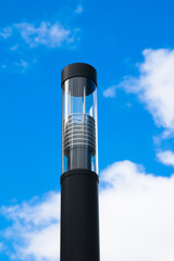 Modern street lantern against the sky
