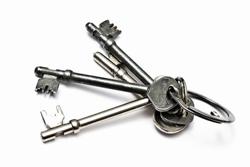 A bunch of old keys isolated on white