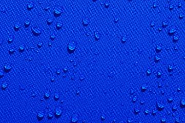 water drops on blue fabric