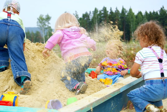 Children Play To A Sandbox