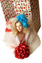 The doll in a gift box.