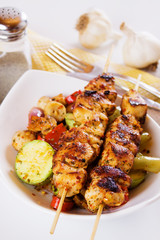 Grilled chicken meat on skewer