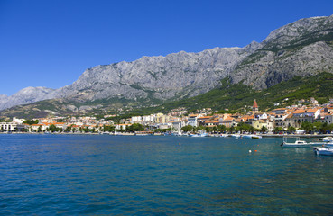Fototapeta na wymiar View from the sea to the embankment Makarska, Croatia