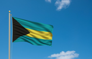 Flag of Bahamas waving in the wind in front of blue sky