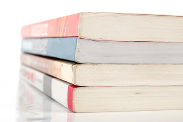 Stack of books on white background