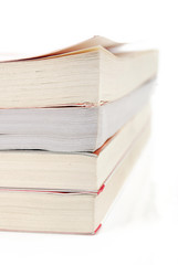Stack of books on white background