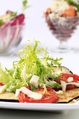 Grilled vegetables and salad greens