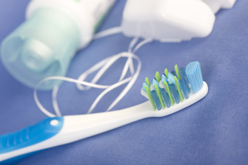 tooth brushe, paste and floss