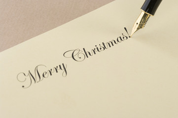 Inscription Merry Christmas with gold pen