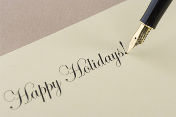 Fototapeta premium Inscription Happy Holidays with gold pen
