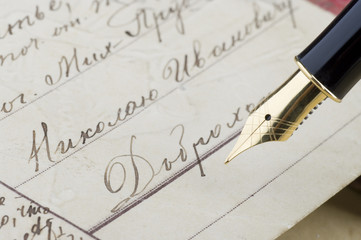 Retro postcard and gold pen