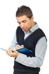 Young executing taking notes