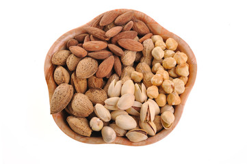 different kernels in a bowl on a white background