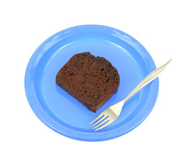 Chocolate cake on blue plate with fork