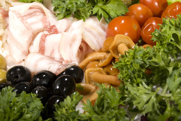 Appetizer with bacon, olives and marinated mushrooms