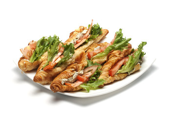 croissant with filling on white plate
