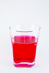 glass of sweet red water for refreshment isolated